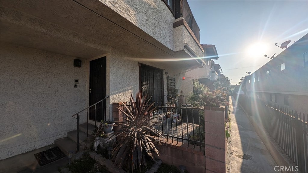 522 N Nicholson Ave Unit A, Monterey Park, CA 91755 - view of side of home featuring stucco siding and fence