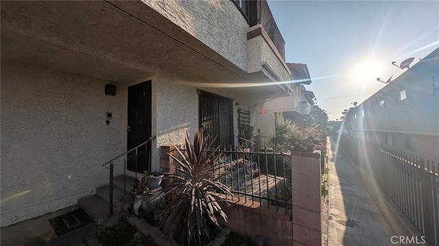 522 N Nicholson Ave Unit A, Monterey Park, CA 91755 - view of side of home featuring stucco siding and fence