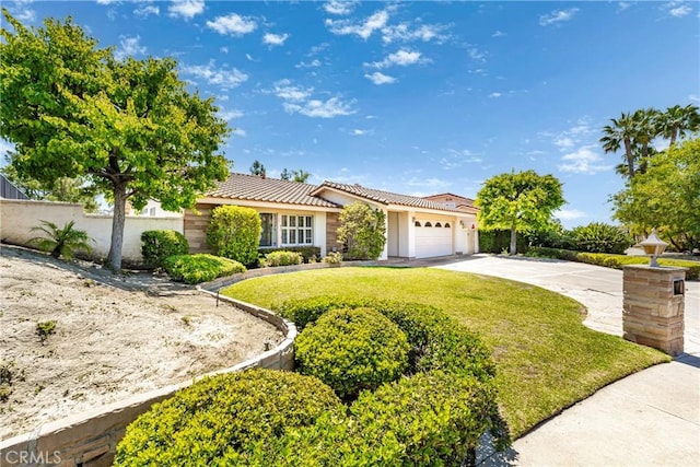 24752 Via, San Anselmo, Mission Viejo, CA 92692 - view of front of property with an attached garage, a tiled roof, concrete driveway, and stucco siding