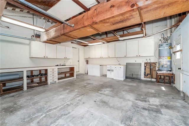 24752 Via, San Anselmo, Mission Viejo, CA 92692 - garage featuring gas water heater and a workshop area