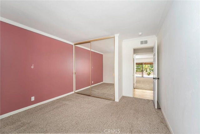 24752 Via, San Anselmo, Mission Viejo, CA 92692 - unfurnished bedroom with light colored carpet, baseboards, a closet, and ornamental molding