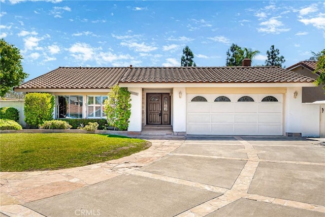 24752 Via, San Anselmo, Mission Viejo, CA 92692 - view of front of house with driveway, a tile roof, a chimney, and a front yard