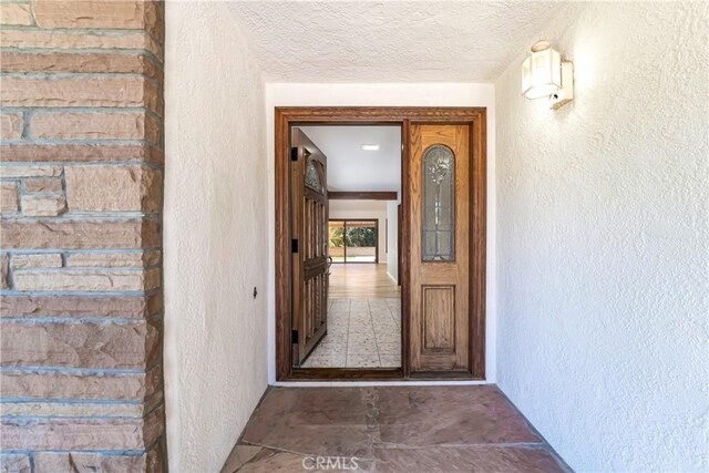 24752 Via, San Anselmo, Mission Viejo, CA 92692 - doorway to property with stucco siding