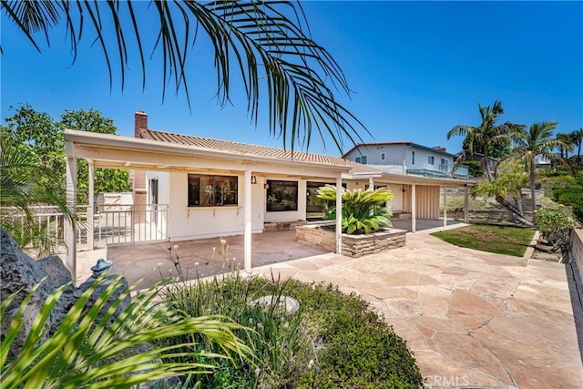 24752 Via, San Anselmo, Mission Viejo, CA 92692 - rear view of property with a patio area, a chimney, and fence
