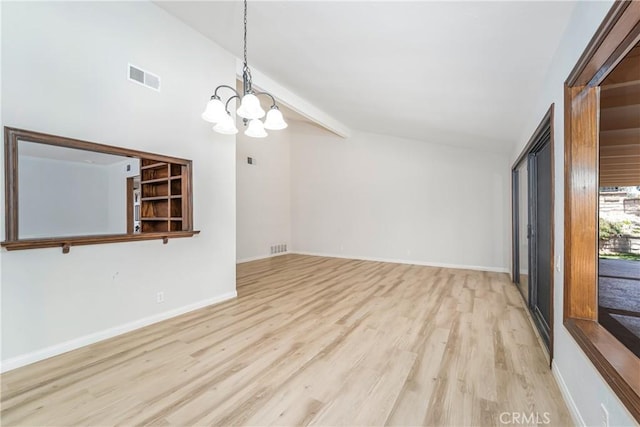 24752 Via, San Anselmo, Mission Viejo, CA 92692 - empty room featuring a chandelier, light wood-type flooring, and baseboards