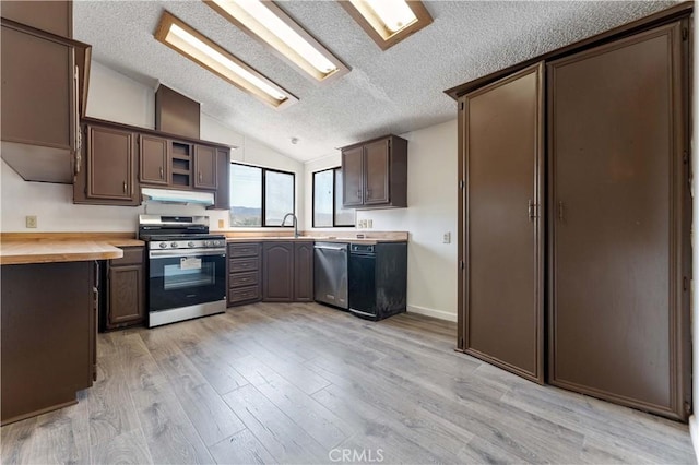 6367 Arrowhead Lake Rd, Hesperia, CA 92345 - kitchen with appliances with stainless steel finishes, vaulted ceiling, under cabinet range hood, light wood-style floors, and light countertops