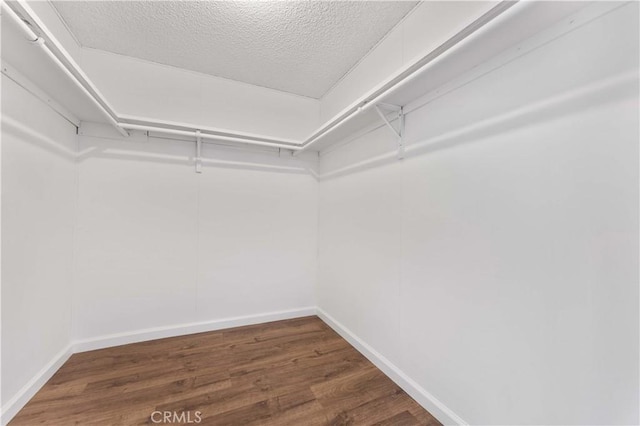 6367 Arrowhead Lake Rd, Hesperia, CA 92345 - walk in closet featuring wood finished floors