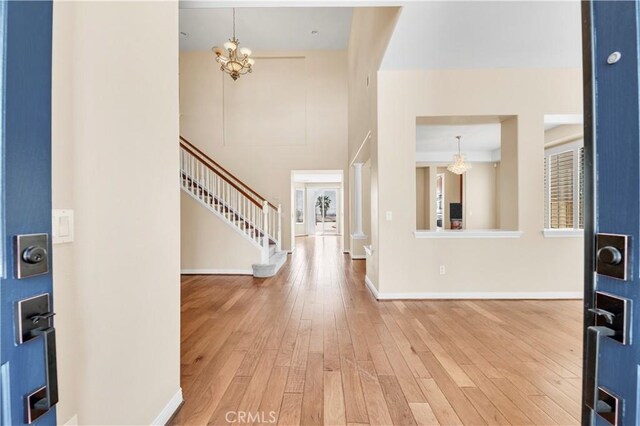 8 Via Del Fico Ct, Lake Elsinore, CA 92532 - entrance foyer featuring a chandelier, wood finished floors, stairs, and baseboards