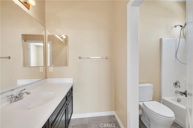 8 Via Del Fico Ct, Lake Elsinore, CA 92532 - bathroom featuring vanity, toilet, bathtub / shower combination, baseboards, and tile patterned flooring