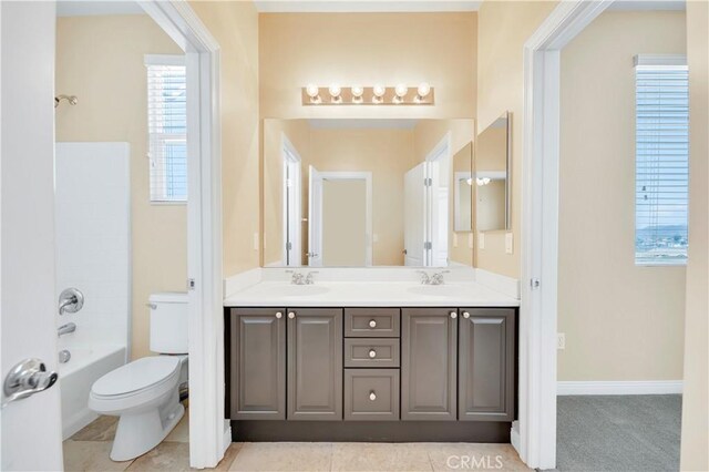8 Via Del Fico Ct, Lake Elsinore, CA 92532 - full bathroom featuring toilet, double vanity, and shower / tub combination