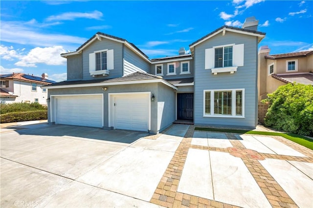 8 Via Del Fico Ct, Lake Elsinore, CA 92532 - traditional-style house featuring a garage, a chimney, and concrete driveway