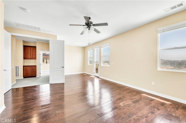 8 Via Del Fico Ct, Lake Elsinore, CA 92532 - unfurnished room with ceiling fan, dark wood-style floors, and baseboards