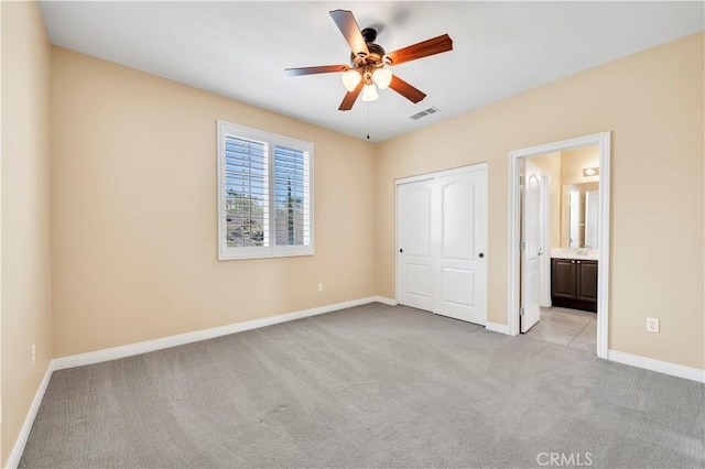 8 Via Del Fico Ct, Lake Elsinore, CA 92532 - unfurnished bedroom with carpet floors, baseboards, a closet, and connected bathroom