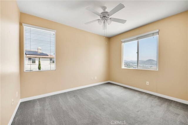 8 Via Del Fico Ct, Lake Elsinore, CA 92532 - unfurnished room with carpet flooring, baseboards, and ceiling fan