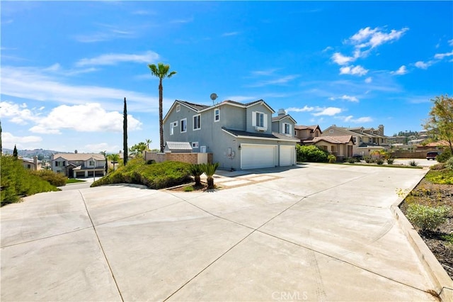 8 Via Del Fico Ct, Lake Elsinore, CA 92532 - view of front of property featuring a residential view, an attached garage, driveway, and stucco siding