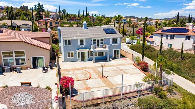 8 Via Del Fico Ct, Lake Elsinore, CA 92532 - back of house with a residential view, a fenced backyard, a patio, and stucco siding