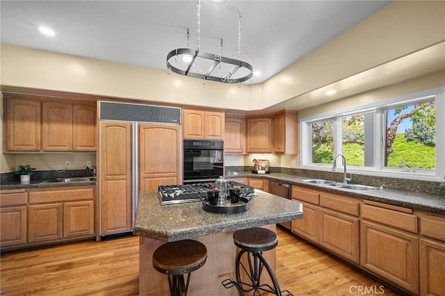 5894 E Appian Way, Long Beach, CA 90803 - kitchen featuring a sink, oven, paneled built in fridge, gas cooktop, and a kitchen breakfast bar