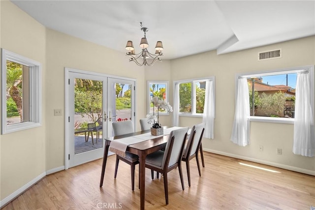 5894 E Appian Way, Long Beach, CA 90803 - dining area with a chandelier, light wood finished floors, healthy amount of natural light, and baseboards