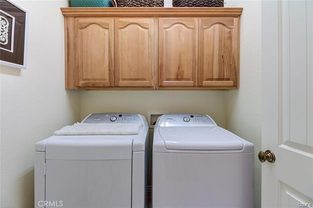 4451 Casa Sierra, Paradise, CA 95969 - washroom with washing machine and dryer and cabinet space