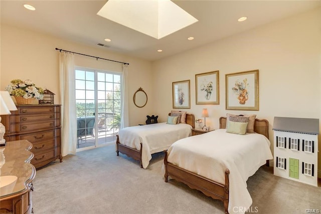 4451 Casa Sierra, Paradise, CA 95969 - bedroom featuring access to exterior, light colored carpet, a skylight, and recessed lighting
