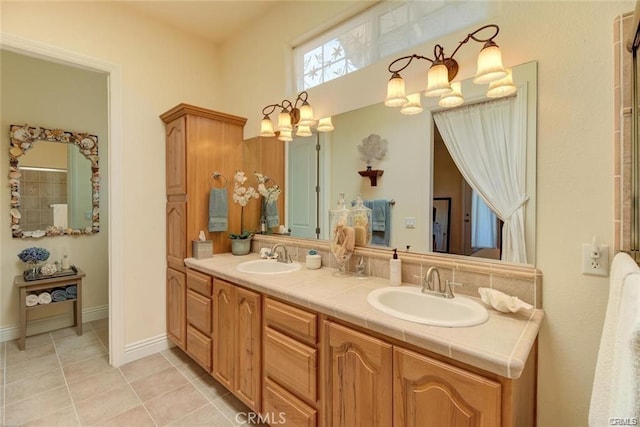 4451 Casa Sierra, Paradise, CA 95969 - bathroom featuring double vanity, tile patterned flooring, and a chandelier