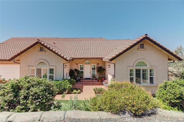 4451 Casa Sierra, Paradise, CA 95969 - view of front of home featuring stucco siding, an attached garage, and a tiled roof