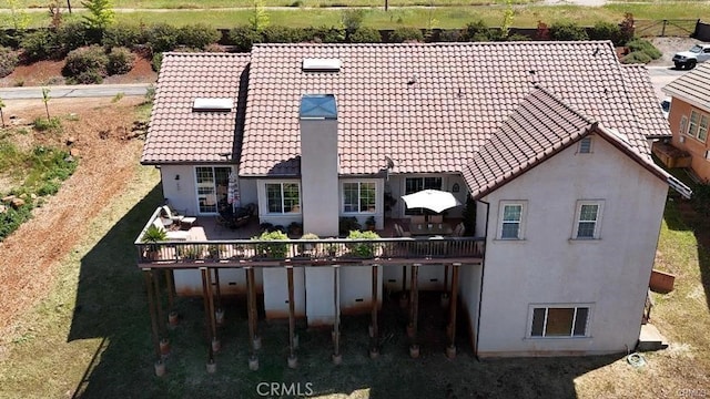 4451 Casa Sierra, Paradise, CA 95969 - back of house featuring a tile roof, stucco siding, and a deck