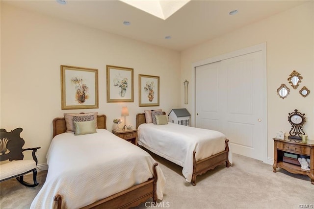 4451 Casa Sierra, Paradise, CA 95969 - bedroom featuring light colored carpet, a closet, a skylight, recessed lighting, and baseboards