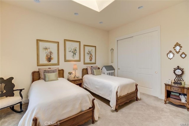 4451 Casa Sierra, Paradise, CA 95969 - bedroom with light carpet, a closet, a skylight, baseboards, and recessed lighting