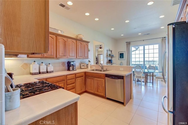 4451 Casa Sierra, Paradise, CA 95969 - kitchen with appliances with stainless steel finishes, a sink, light countertops, a peninsula, and recessed lighting