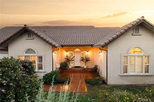 4451 Casa Sierra, Paradise, CA 95969 - rear view of property with stucco siding and a tile roof