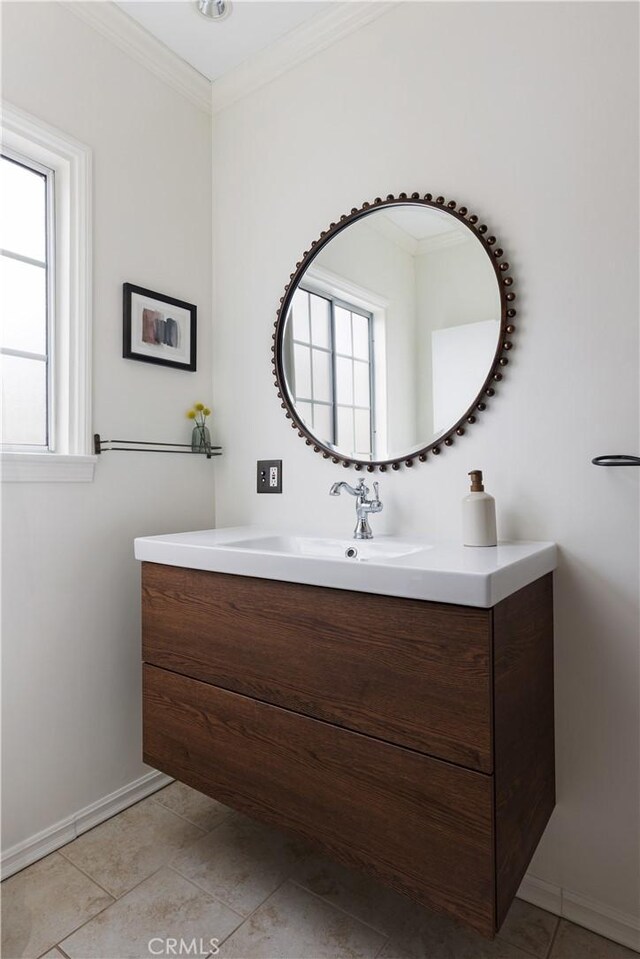 6062 Gaviota Ave, Long Beach, CA 90805 - bathroom with plenty of natural light, vanity, crown molding, and baseboards