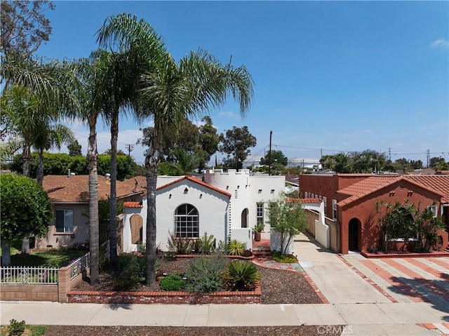 6062 Gaviota Ave, Long Beach, CA 90805 - mediterranean / spanish-style home with stucco siding and driveway