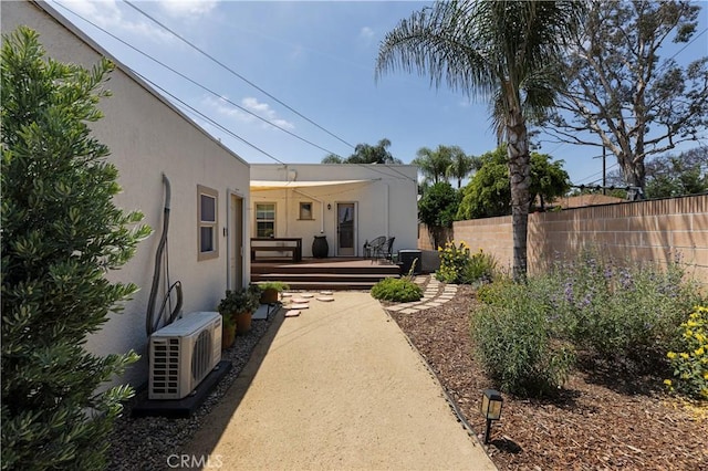 6062 Gaviota Ave, Long Beach, CA 90805 - view of yard with fence, a wooden deck, and a cooling unit