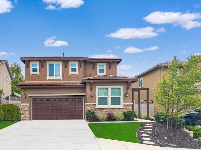 view of front of property featuring stone siding, an attached garage, driveway, and stucco siding