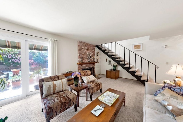 living room featuring carpet, stairway, and a large fireplace