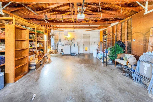 garage with water heater and washer / clothes dryer
