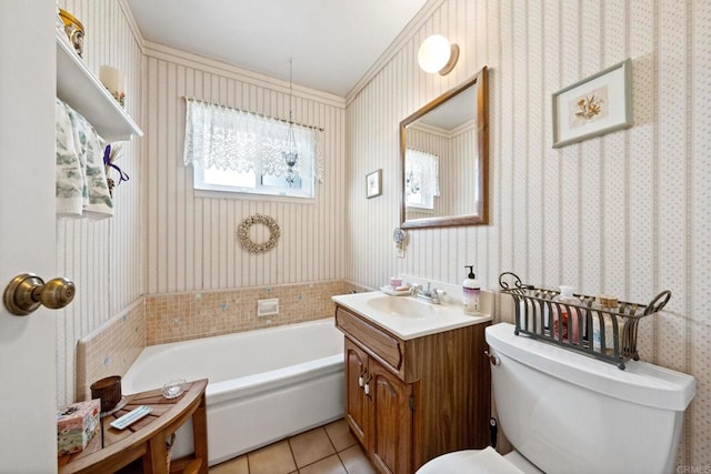 bathroom with wallpapered walls, toilet, tile patterned flooring, a tub, and vanity