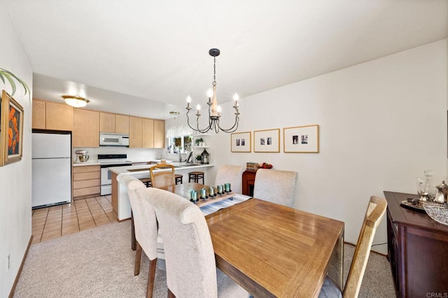dining space featuring a chandelier, light carpet, and light tile patterned flooring