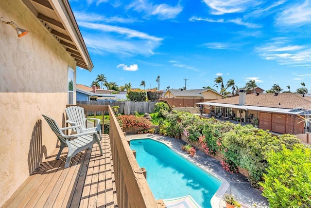 view of swimming pool with a fenced backyard