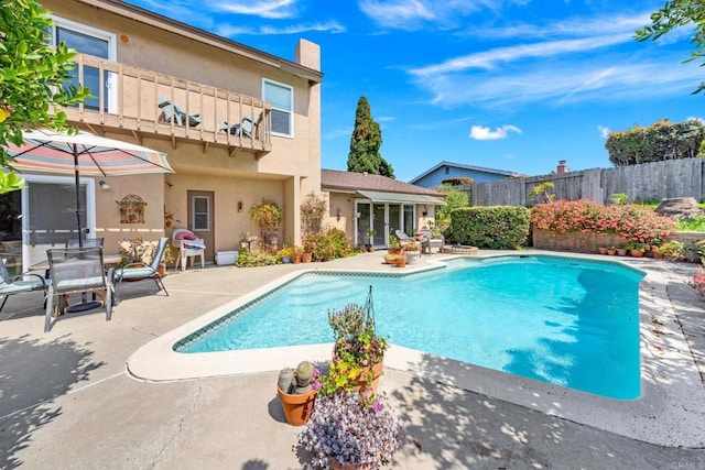 view of pool with a patio area and a fenced backyard