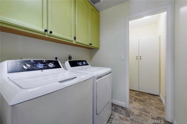 16350 Ridge View Dr, Apple Valley, CA 92307 - laundry area featuring cabinet space, washer and clothes dryer, stone finish floors, and baseboards