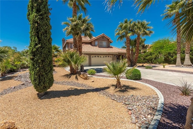 16350 Ridge View Dr, Apple Valley, CA 92307 - mediterranean / spanish home featuring concrete driveway, a tiled roof, and stucco siding