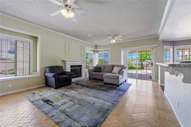 16350 Ridge View Dr, Apple Valley, CA 92307 - living room featuring ceiling fan, baseboards, a fireplace, a textured ceiling, and ornamental molding