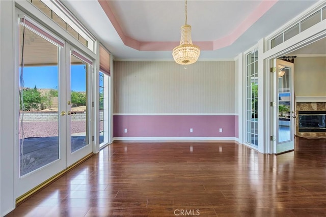 16350 Ridge View Dr, Apple Valley, CA 92307 - empty room featuring french doors, a chandelier, wood finished floors, and baseboards