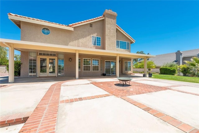 16350 Ridge View Dr, Apple Valley, CA 92307 - back of house featuring french doors, stucco siding, and a patio