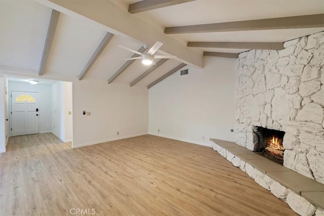 4180 Mount Baldy Ct, Norco, CA 92860 - unfurnished living room with a stone fireplace, ceiling fan, light wood-type flooring, and baseboards