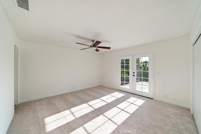 4180 Mount Baldy Ct, Norco, CA 92860 - empty room featuring french doors, light colored carpet, a ceiling fan, and baseboards