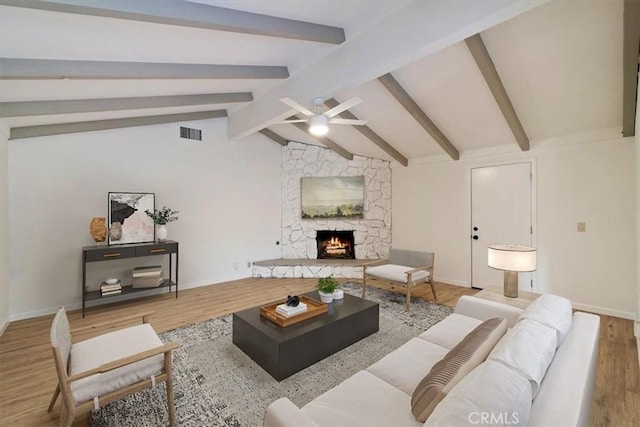4180 Mount Baldy Ct, Norco, CA 92860 - living room featuring a ceiling fan, wood finished floors, a stone fireplace, and baseboards