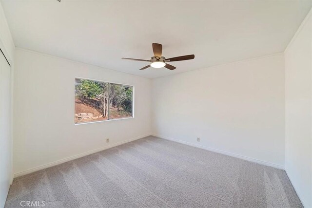 4180 Mount Baldy Ct, Norco, CA 92860 - carpeted empty room with a ceiling fan and baseboards